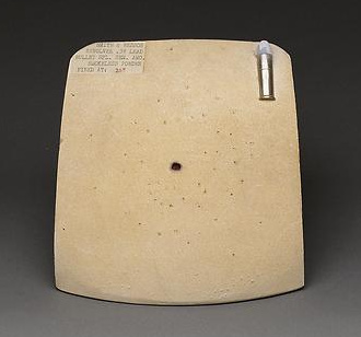 Test card fired at distant range showing only the hole
