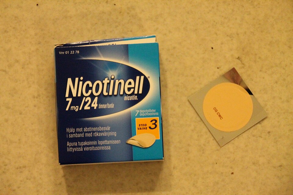 A transdermal nicotine patch applied to the skin, a form of nicotine replacement therapy