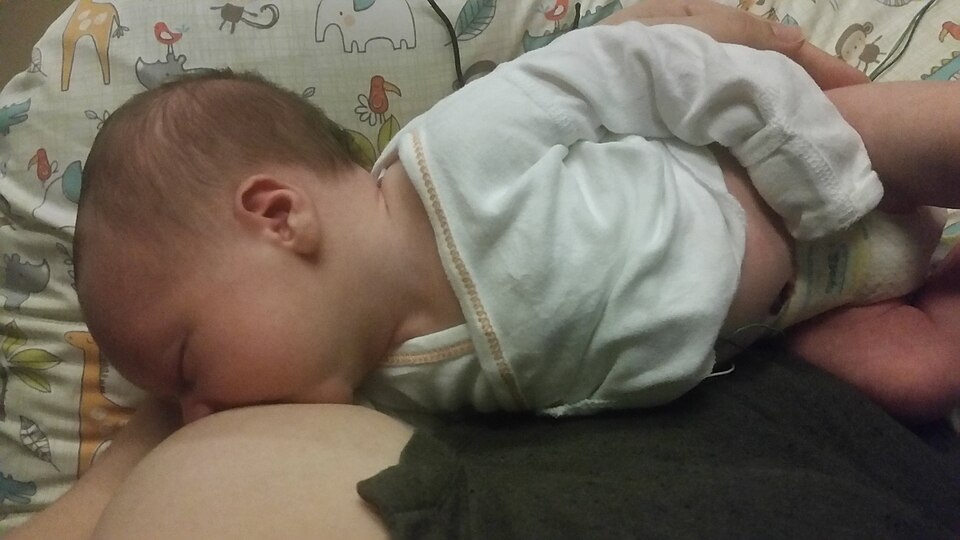 A newborn
  breastfeeding
