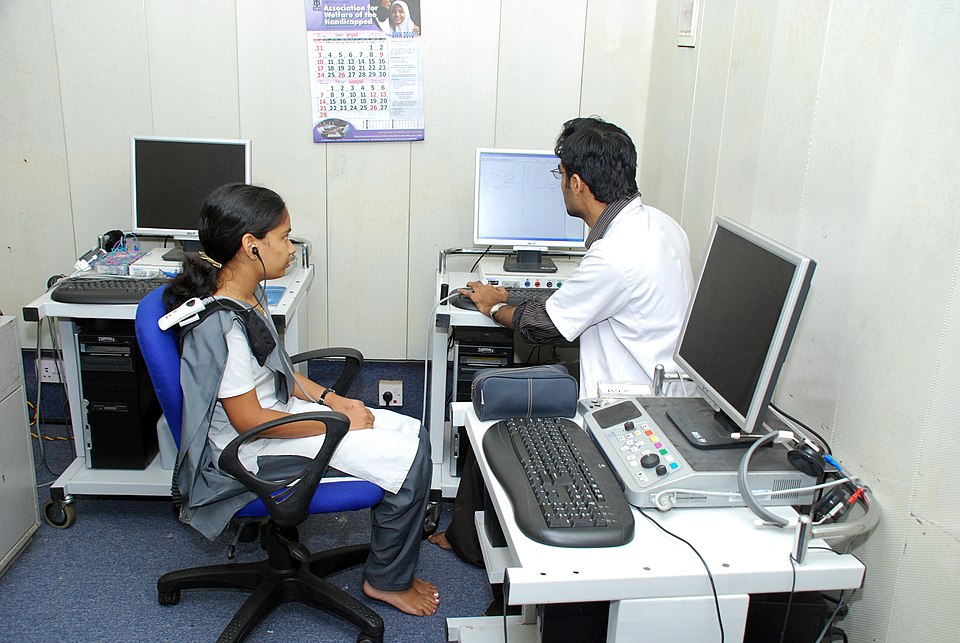 A hearing assessment (audiometry) being
  performed by an audiologist
