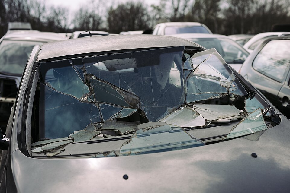 Shattered toughened windscreen glass on a car after a collision